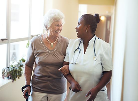 Caregiver Walking with Senior